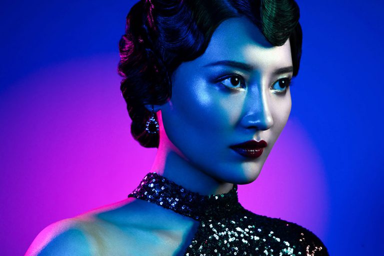 Asian model with blue and pink gels - Lindsay Adler Photography