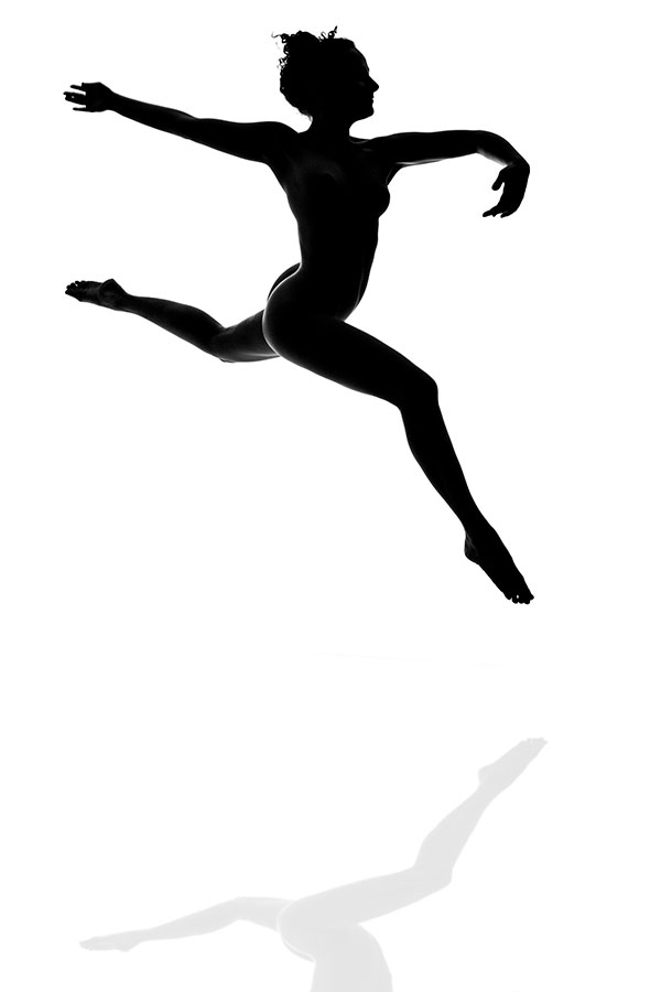 Fine Art Nude photography training - model in silhouette jumping as a dancer - Lindsay Adler Photography